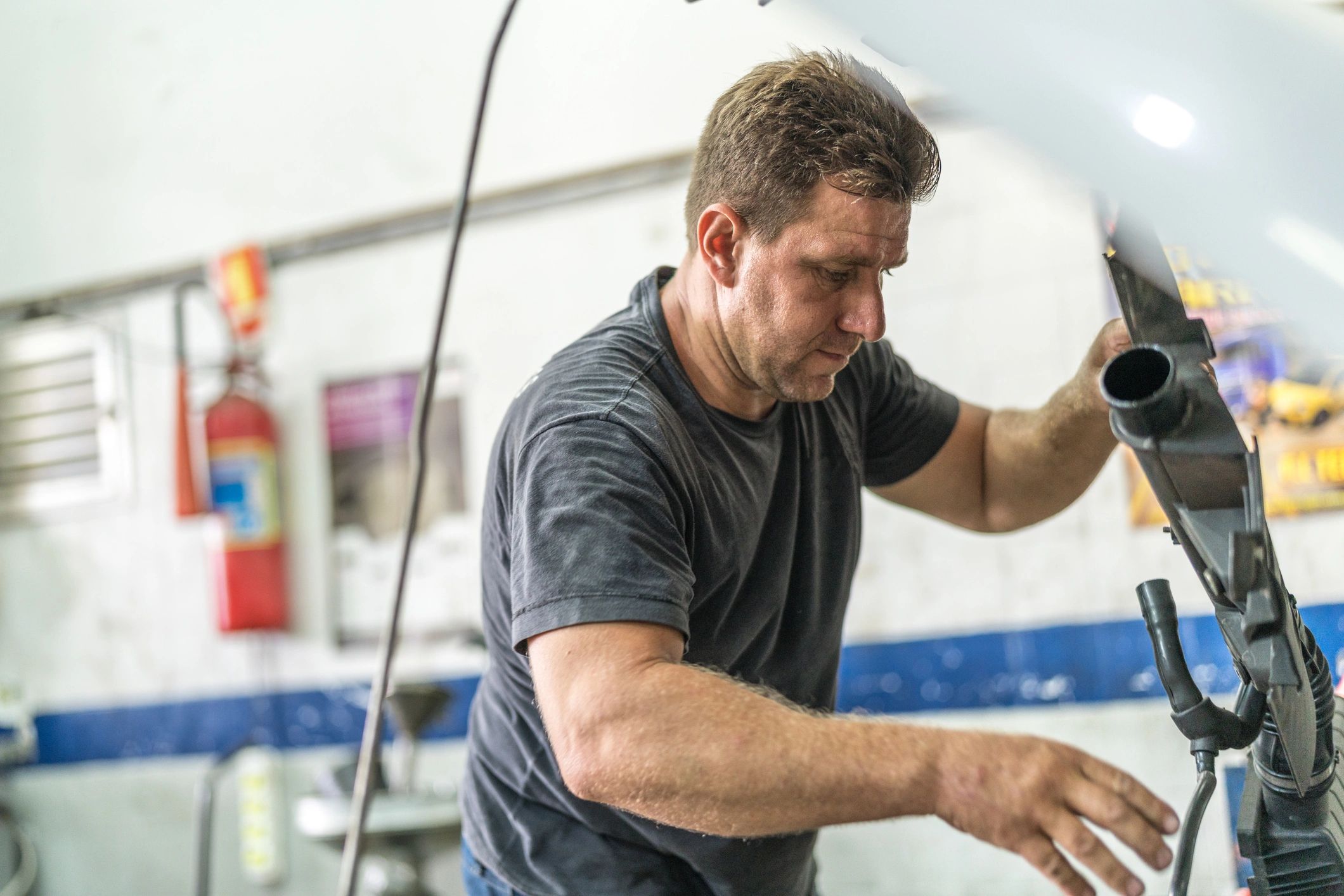 Mechanic working on a vehicle in an auto repair shop