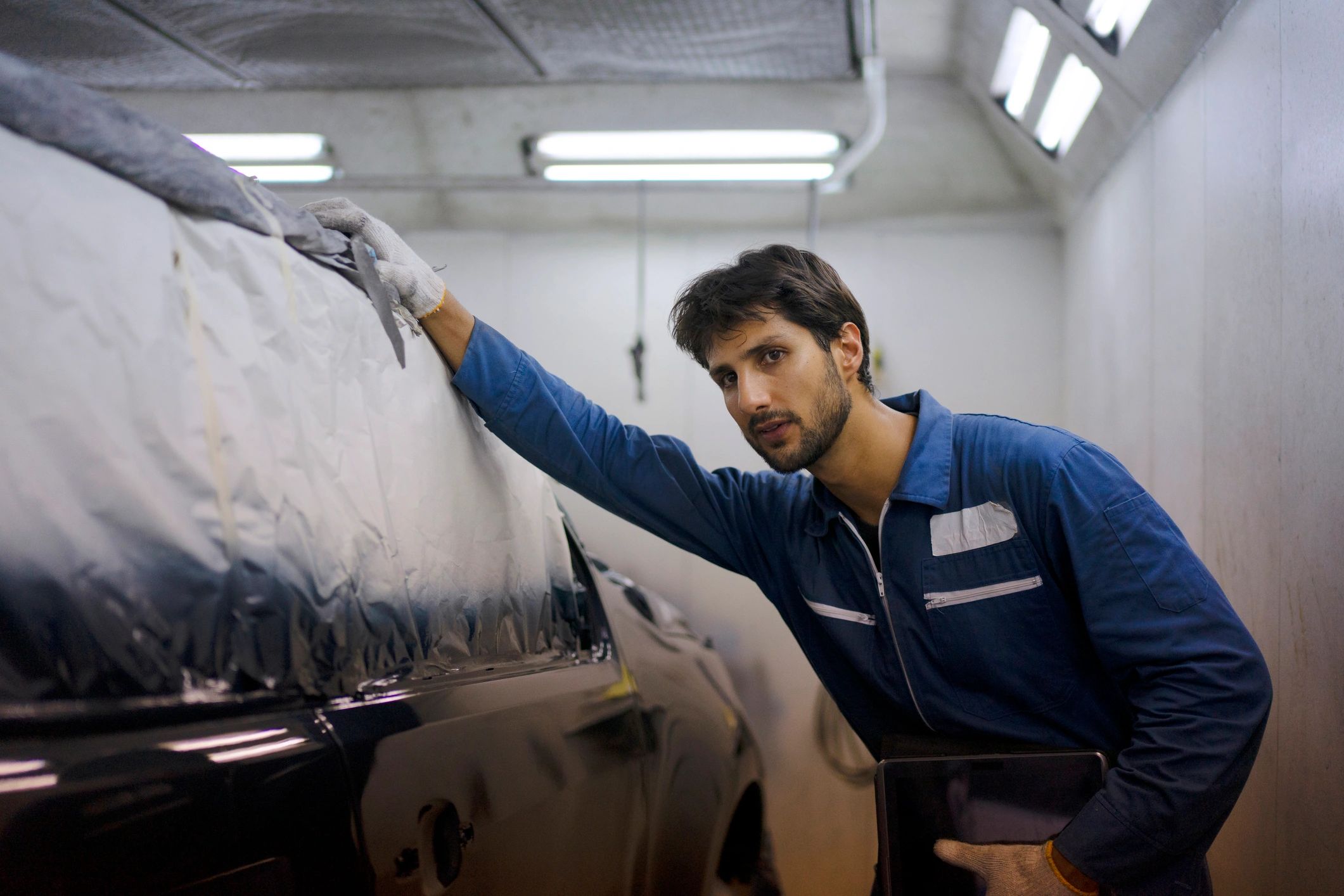 Auto shop technician working in a garage setting