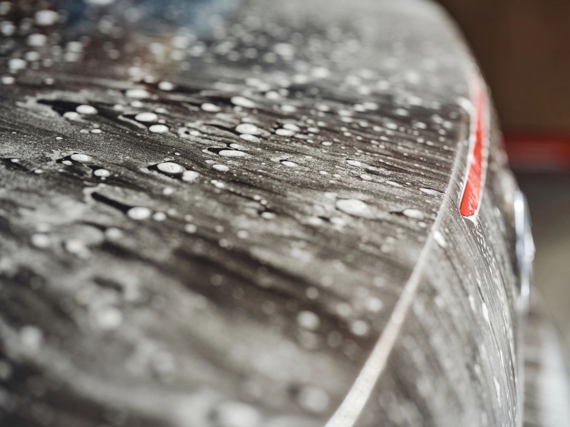 Soap suds on a car during wash