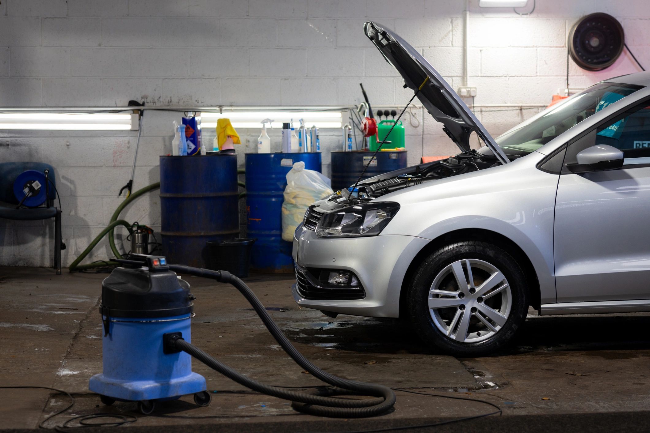 Car inside a garage bay during service